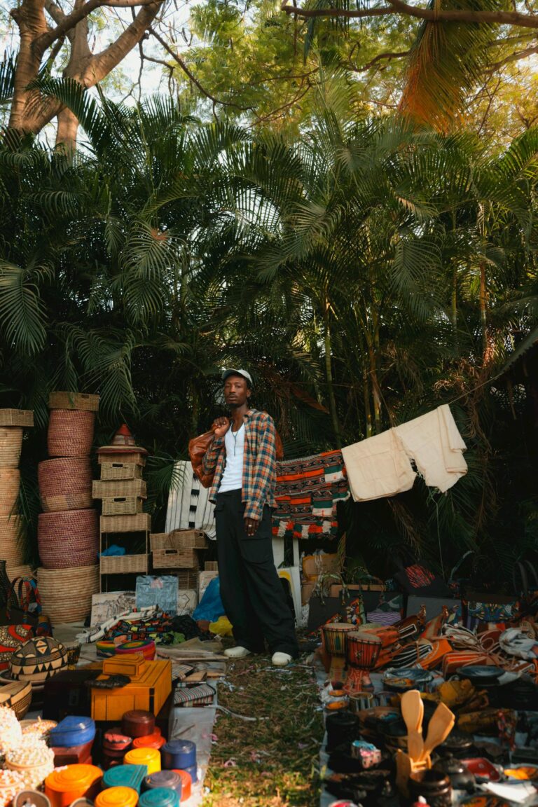 A vibrant display of handmade crafts and patterns at an art market in Abuja, Nigeria.