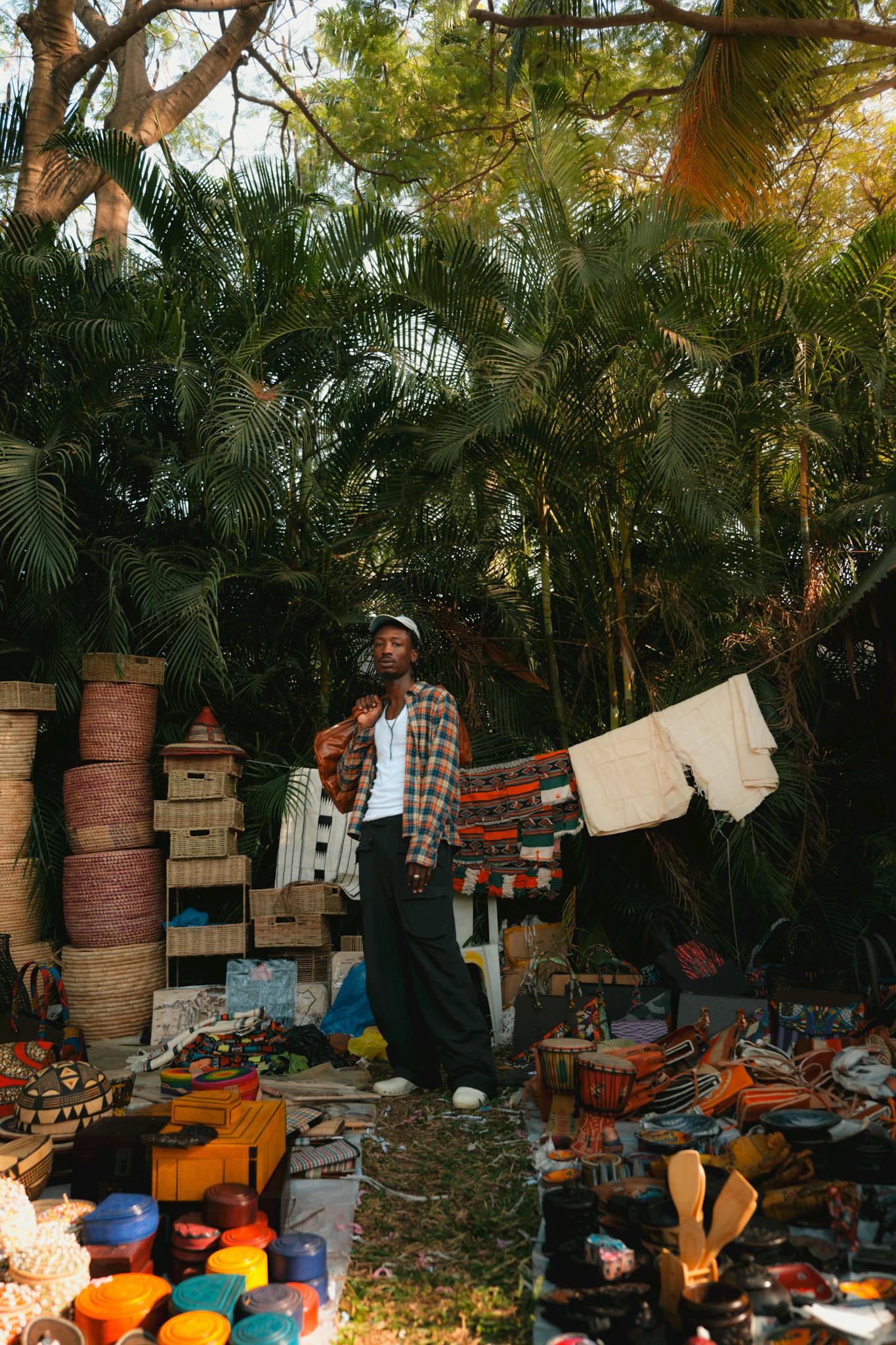 A vibrant display of handmade crafts and patterns at an art market in Abuja, Nigeria.