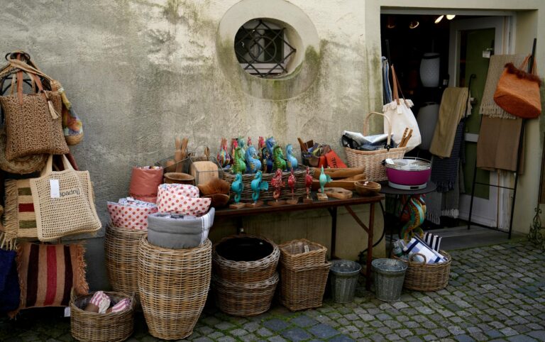 Colorful display of handcrafted goods and baskets at an outdoor market. Perfect for decor lovers.