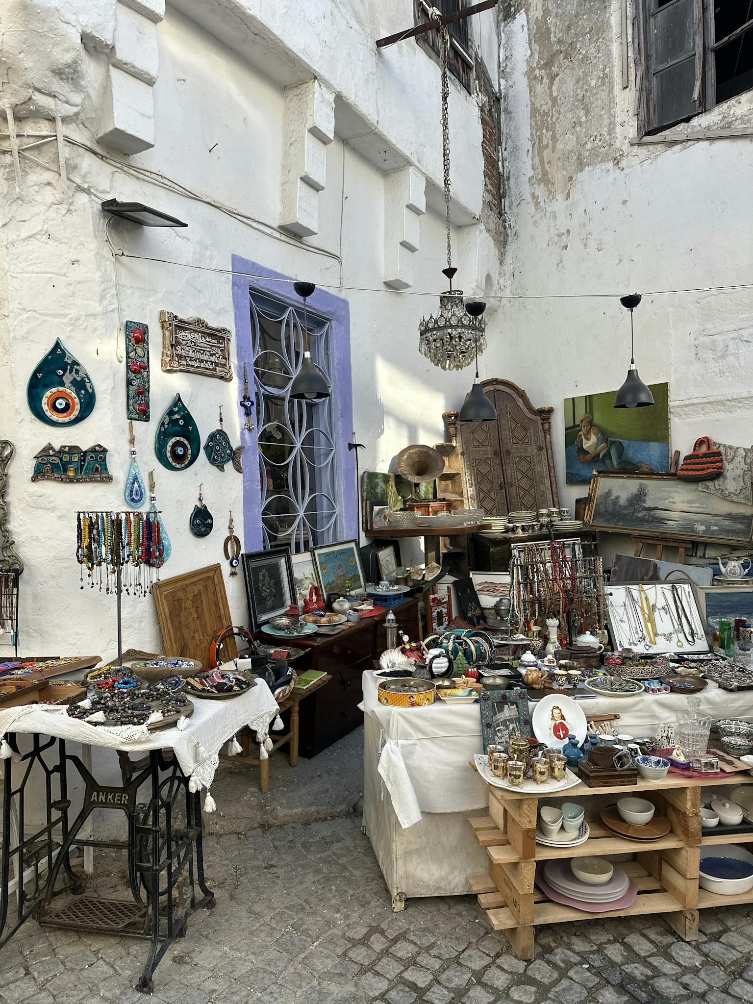 Explore this charming artisan shop featuring unique handcrafted items like jewelry, ceramics, and wall art.